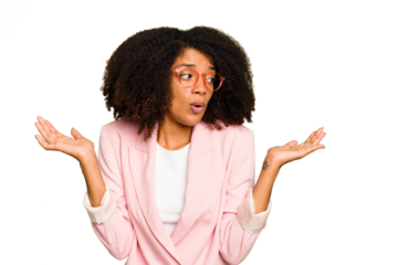 Young African American woman isolated confused and doubtful shrugging shoulders to hold a copy space.