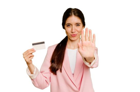 Business caucasian woman holding a credit card isolated standing with outstretched hand showing stop sign, preventing you. - Powered by Adobe