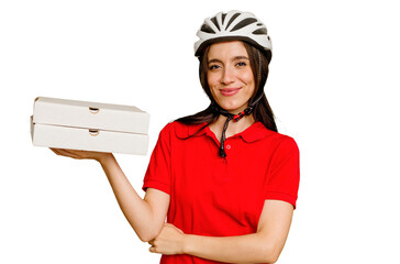 Young caucasian woman holding takeaway pizzas isolated laughing and having fun.