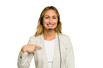 Telemarketer caucasian woman working with a headset isolated on green chroma background person pointing by hand to a shirt copy space, proud and confident