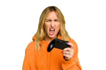 Young caucasian gamer woman holding a game controller isolated on green chroma background screaming very angry and aggressive.