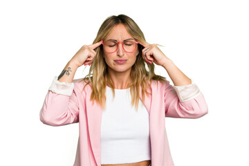 Young caucasian woman isolated on green chroma background focused on a task, keeping forefingers...