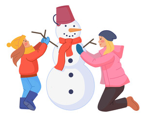 Mom and daughter making snowman. Winter family activity