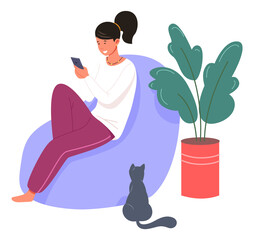 Young woman sitting on lazy chair withsmartphone. Social media addiction