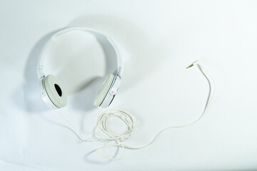 white headphone with cable isolated with white background