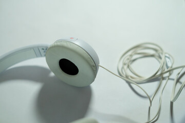 white headphone with cable isolated with white background