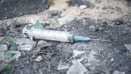 Used syringes, discarded, Syringes lie in an abandoned house, at a construction site, in ruins, in the garbage, drug addicts left the drug