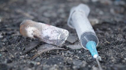 Used syringes, discarded, Syringes lie in an abandoned house, at a construction site, in ruins, in the garbage, drug addicts left the drug