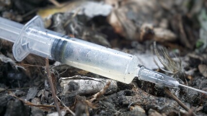 Syringes lie in an abandoned house, at a construction site, in ruins, in the garbage, drug addicts left the drug