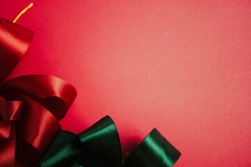 Bright red and green ribbon for Christmas and new year concept background