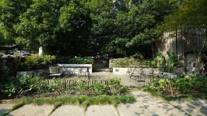 The beautiful garden view with the flowers and stone tables in the countryside village of the China