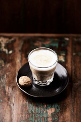 Coffee with milk on dark wooden background. Soft focus. Copy space.	                                                            