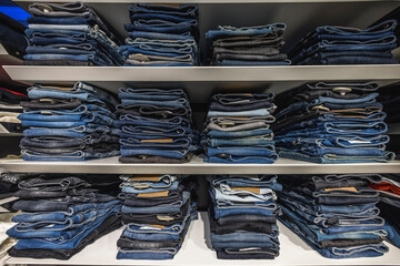 Close up view of cells with jeans in clothing store