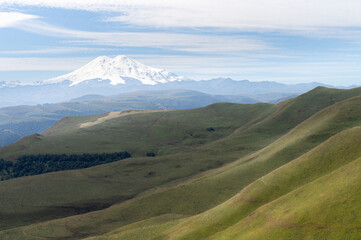 Fototapeta premium Mount Elbrus in summer. hills and meadows of Caucasus