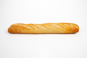 Freshly baked quality baguette on white background side view