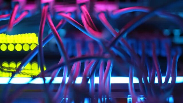 Super computer server racks in datacenter. Concept of big data storage and mining cryptocurrency. Network routers of ISP. Many wires connect to the network interfaces of powerful internet servers