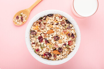 Oat muesli with nuts, dried berries and seeds in a bowl for a healthy breakfast