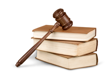 Books and wooden gavel on table. Justice concept