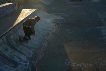  Portrait of young non-binary skating on skateboard at skatepark  © Sheilby Macena