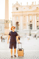 young man tourist in Rome at Vatican city on vacation, an emigrant. moving to a new country. young female student on the background of a European city. Around the world