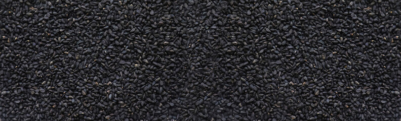 There are many black cumin seeds. Selective focus.