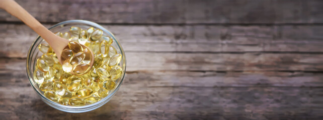 Vitamin E in fat-soluble capsules. Selective focus.