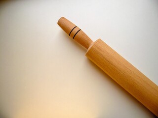 rolling pin for dough on a light background, close-up
