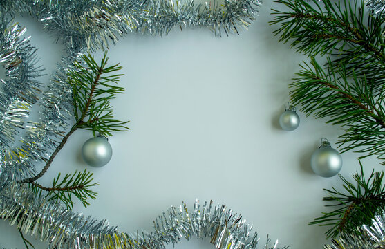 Christmas Tree Branches, Tinsel And Christmas Balls.