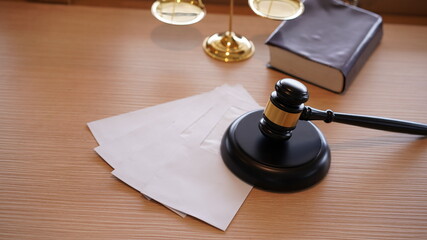 Lawyer or judge's hammer in the court. Auction's hammer and judgement golden scale are on wood...