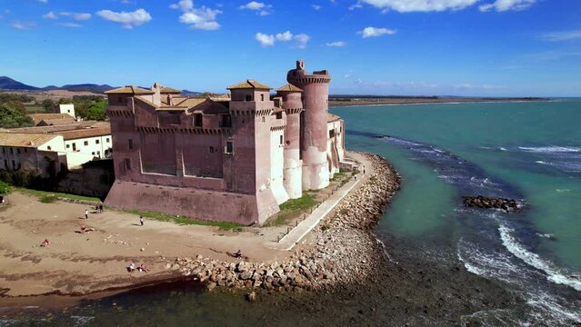 Great Medieval castles of Italy - imposing Castello di Santa Severa on the beach. Lazio region, aerial drone video