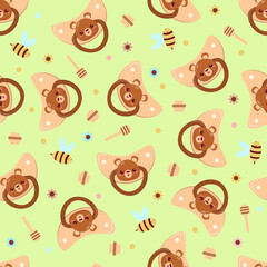 Seamless children's pattern on a green background. A dummy with a bear. Pacifier for children.