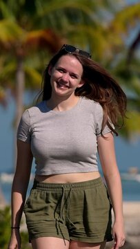 Young woman walking on a Caribbean Paradise beach - travel photography