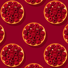 Tart with fresh berries and cream on red background in hard light