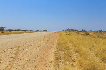 Fototapeta na wymiar Namibian landscape along the gravel road. Rehoboth, Namibia.