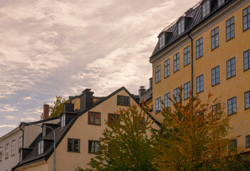 Old 1700s houses in the block Mariaberget, shady sky an autumn day in Stockholm