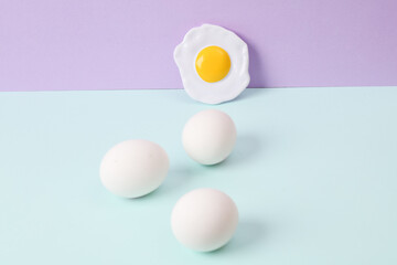 Creative layout with eggs on pastel background. Conceptual pop. Minimal still life. Food concept