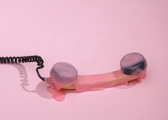 Creative 80s layout, Retro phone tube with slime on pink background with shadow. Visual trend. Fresh idea. Concept pop