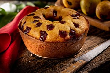 Tasty homemade cornmeal cake with guava pieces, with sliced ​​cake piece, selective focus and closeup