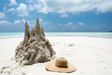 Sand castle on tropical white sand beach in Maldives. Holiday concept with sandcastle on sand castle on seaside.