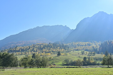 Fototapeta na wymiar Sun rays over the mountain in autumn afternoon
