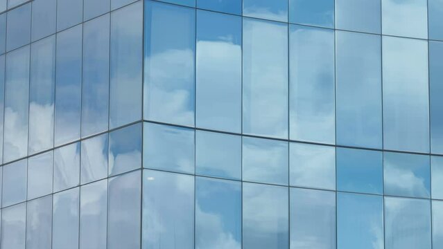 The glass window of the building in the city with the reflection of the sky in Estonia