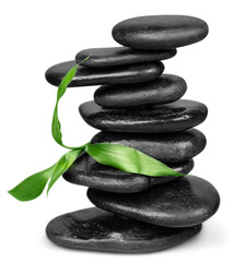 Zen basalt stones and leaves on background