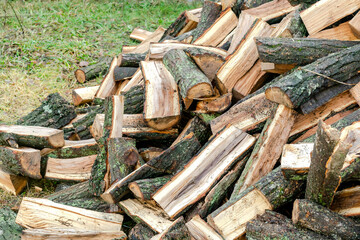 Industrial timber wood,lumber material for roofing construction. stack chopped dry trunks, Fire logs