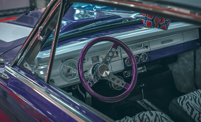 Elegant vintage retro car. View of the steering wheel and dashboard of an old vintag car