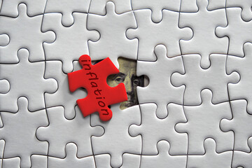 Fototapeta premium US Dollar Banknote with red Jigsaw puzzle with text inflation