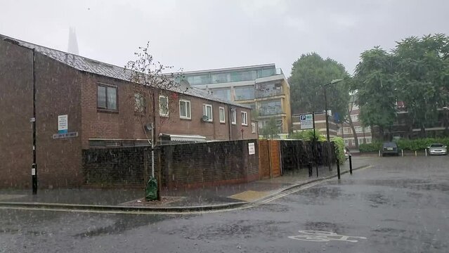 Slow motion of a heavy rain at a housing estate in Bermondsey, London, UK