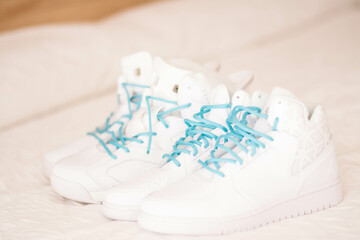 White Shoes with Turquoise Shoe Laces and White Background
