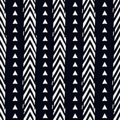 Seamless pattern. Paint brush chevrons ornament. Hand drawn geometrical backdrop. Triangular shapes wallpaper. Geometric figures background. Ethnic motif. Textile print. Vector abstract.