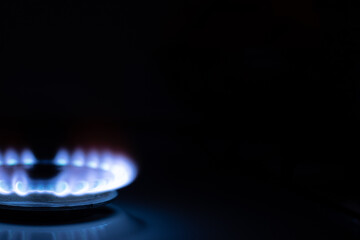 Gas burns with blue flames. Gas crisis around the world. Selective focus on the flame. Soft focus on the picture. Natural gas for housing