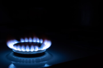 Gas burns with blue flames. Gas crisis around the world. Selective focus on the flame. Soft focus on the picture. Natural gas for housing